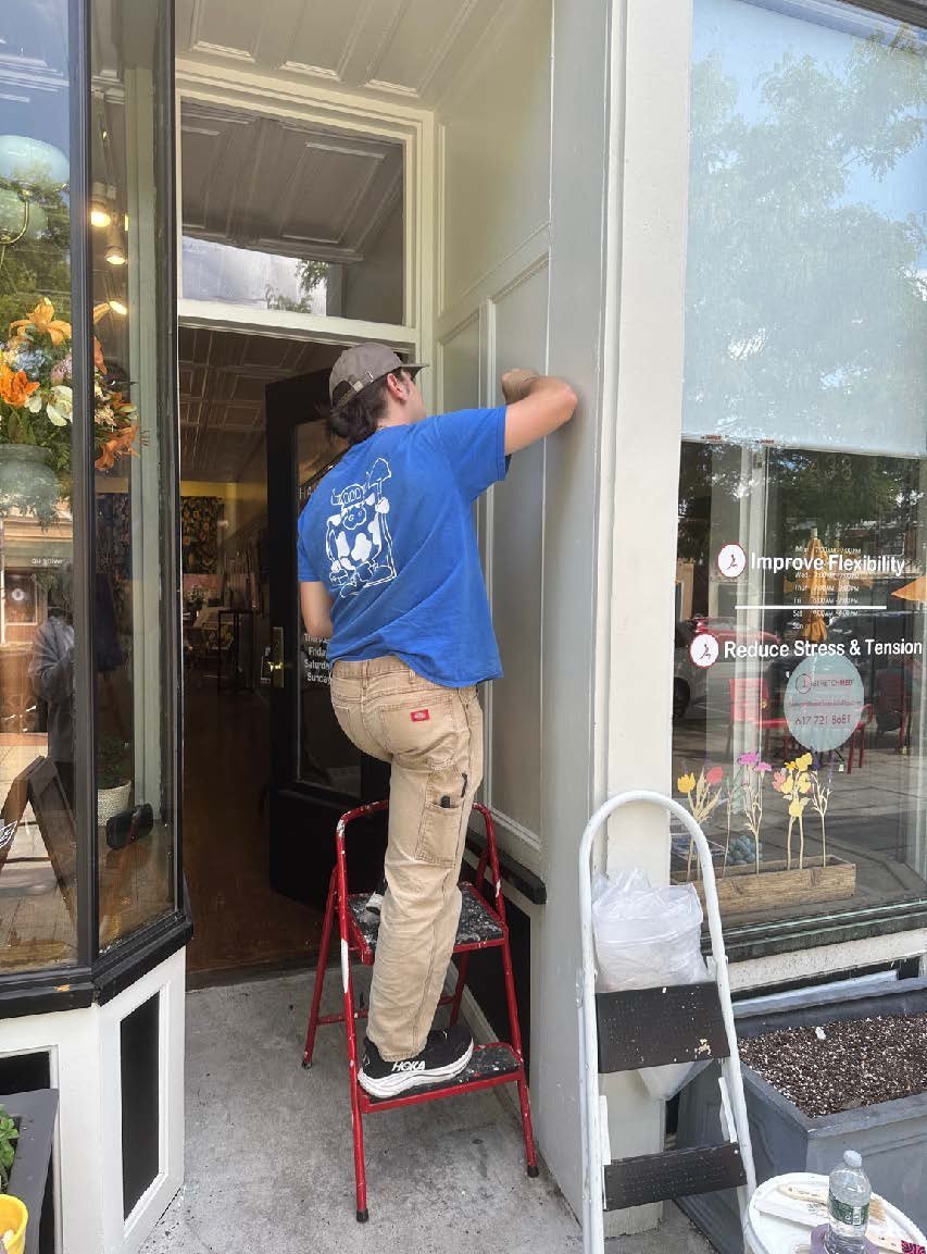 Painting a mural on the Hawthorn Gallery door